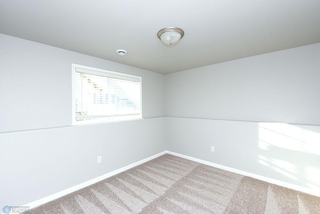 unfurnished room with carpet flooring