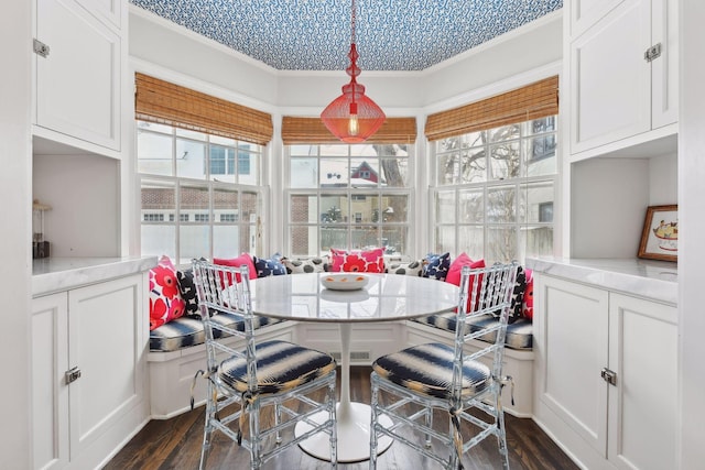 dining space with breakfast area and dark hardwood / wood-style flooring