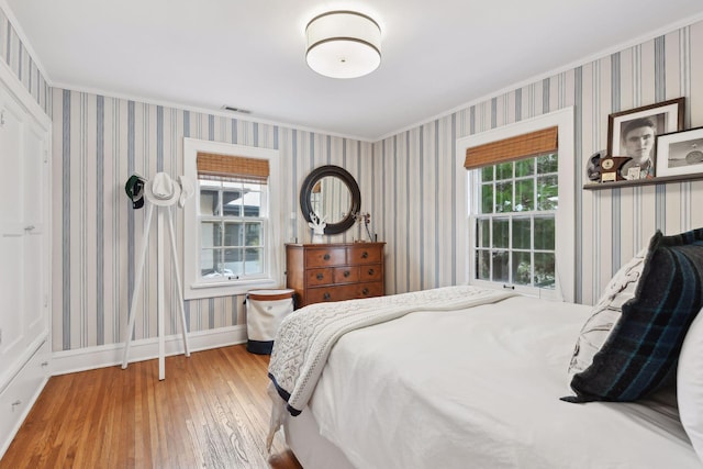 bedroom with hardwood / wood-style flooring