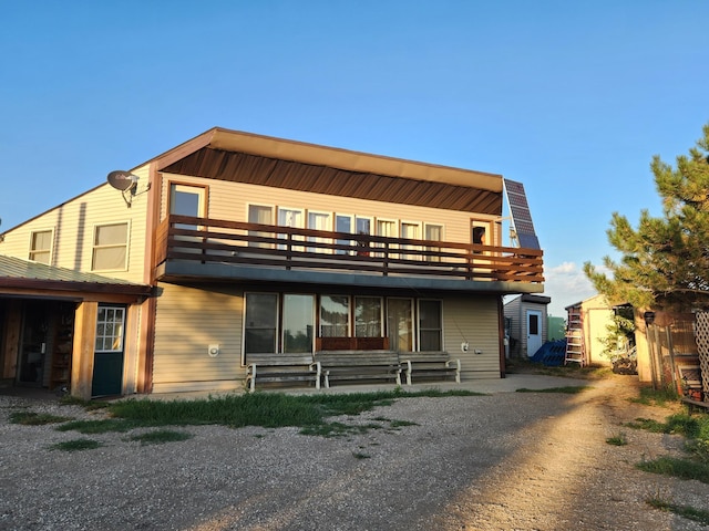 view of front of house with a balcony