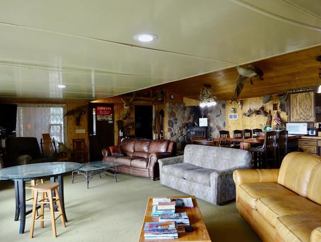 living room with carpet flooring and wooden walls