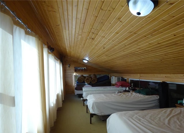 bedroom with wooden walls, wood ceiling, and lofted ceiling