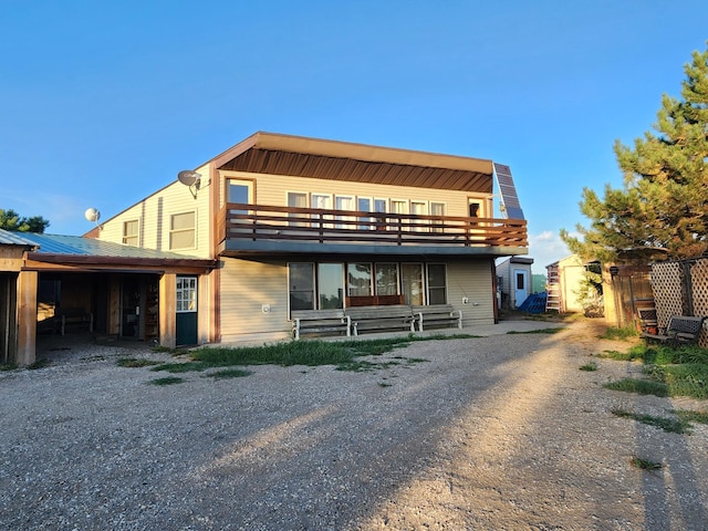 view of front of house with a balcony