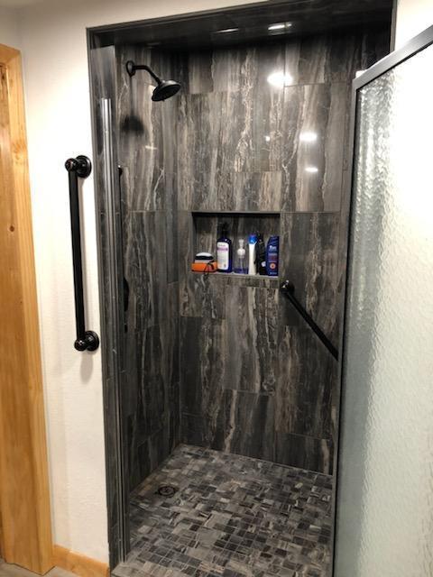 bathroom featuring an enclosed shower