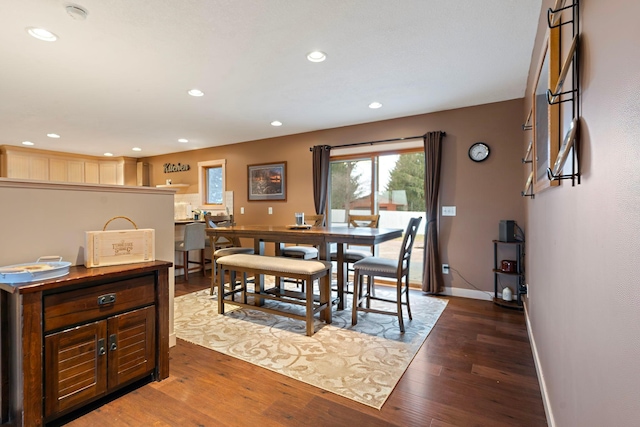 dining room with recessed lighting, wood finished floors, and baseboards