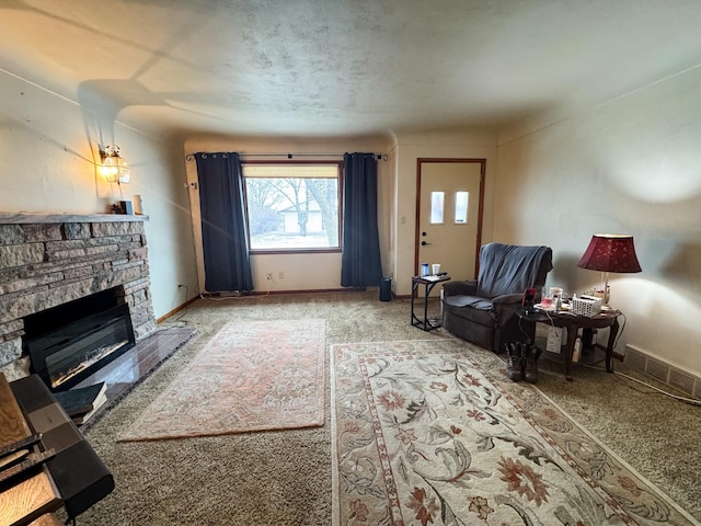 living room with carpet flooring and a fireplace