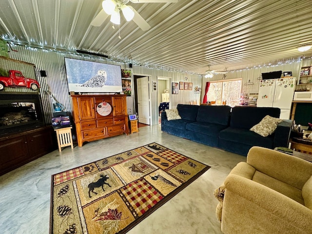 living room featuring concrete flooring and ceiling fan