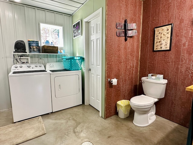 washroom with washing machine and dryer and laundry area