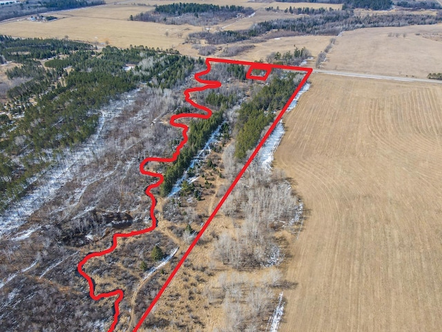 birds eye view of property with a rural view