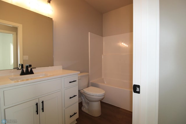 bathroom featuring vanity, toilet, and hardwood / wood-style floors