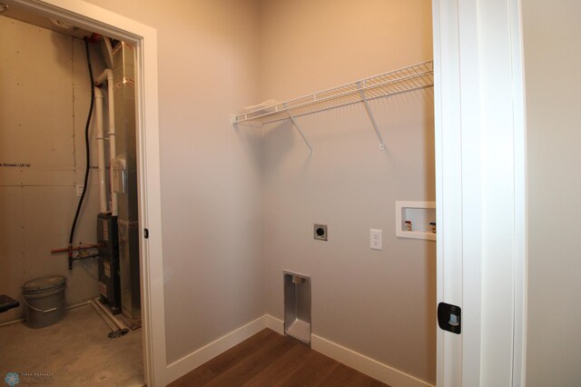 laundry area featuring hookup for a washing machine, dark wood-type flooring, and hookup for an electric dryer