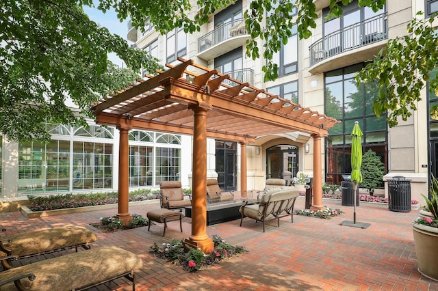 view of patio / terrace with an outdoor living space and a pergola