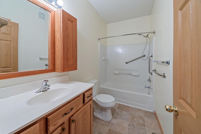 full bathroom with vanity, bathtub / shower combination, a textured ceiling, and toilet