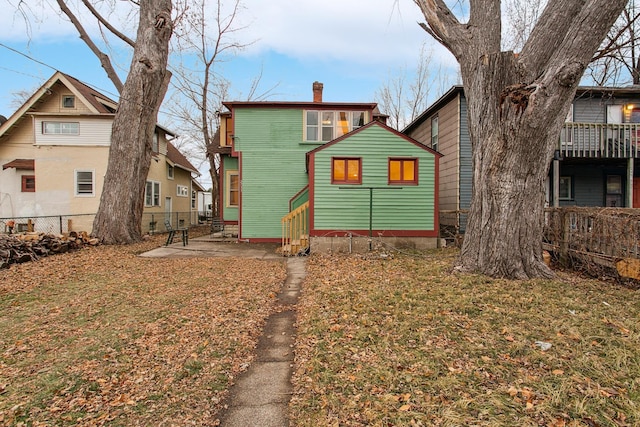 back of house with a yard