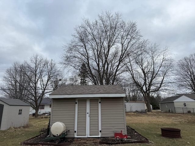 view of outbuilding with a lawn