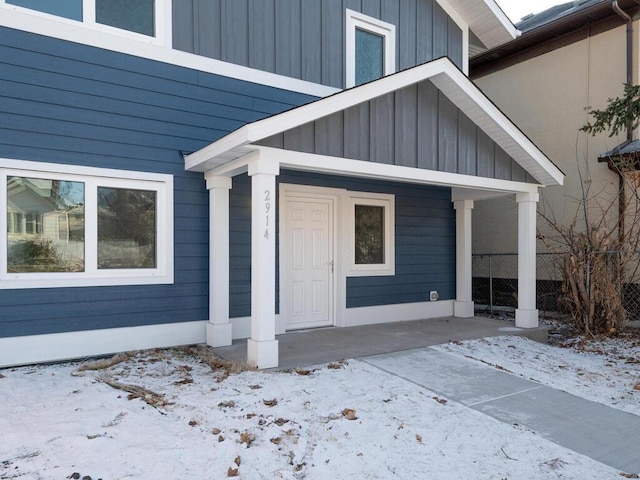 view of snow covered property entrance