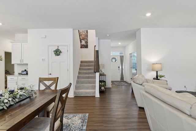 living room featuring dark hardwood / wood-style flooring