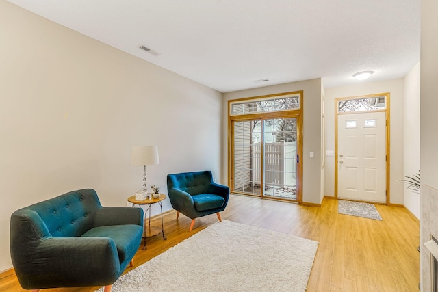 sitting room with light hardwood / wood-style flooring