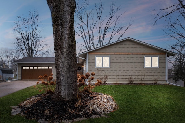 view of front of property with a lawn and a garage