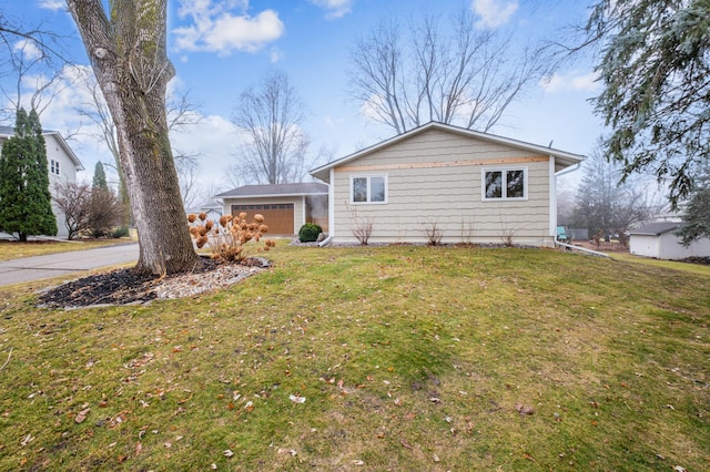 exterior space featuring a garage and a yard