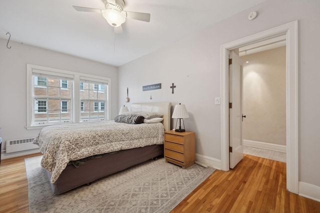 bedroom with ceiling fan and light wood-type flooring