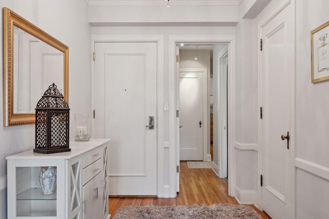 hall with light hardwood / wood-style floors