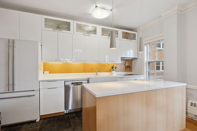 kitchen with sink, dishwasher, a center island, high end white refrigerator, and white cabinets