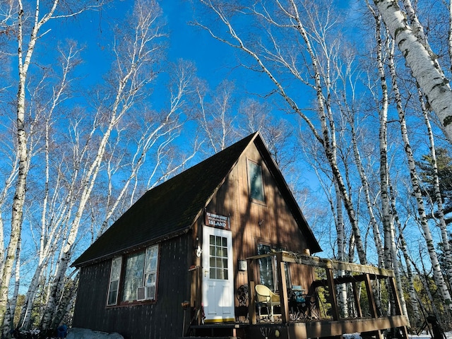 22510 Spider Is, Mantrap Twp, MN 56467 - view of property exterior featuring a wooden deck and roof with shingles