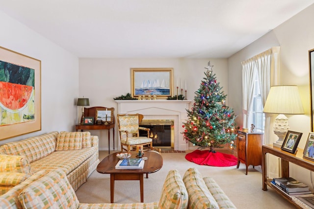 living room with light carpet and a brick fireplace