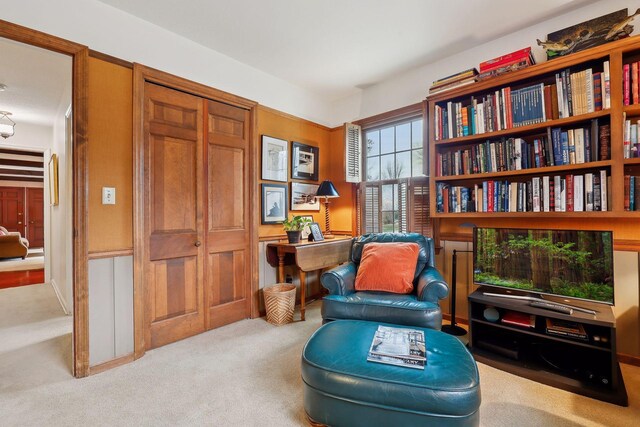 sitting room with light colored carpet