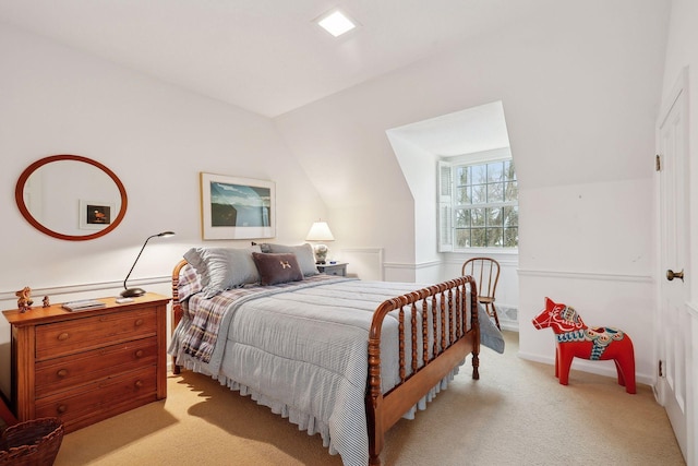 bedroom with light carpet and vaulted ceiling