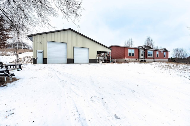 view of snow covered garage