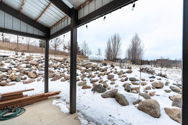 view of yard layered in snow