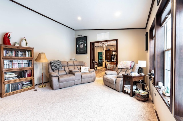 carpeted living room featuring vaulted ceiling and ornamental molding