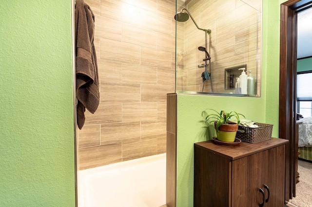 bathroom featuring tiled shower