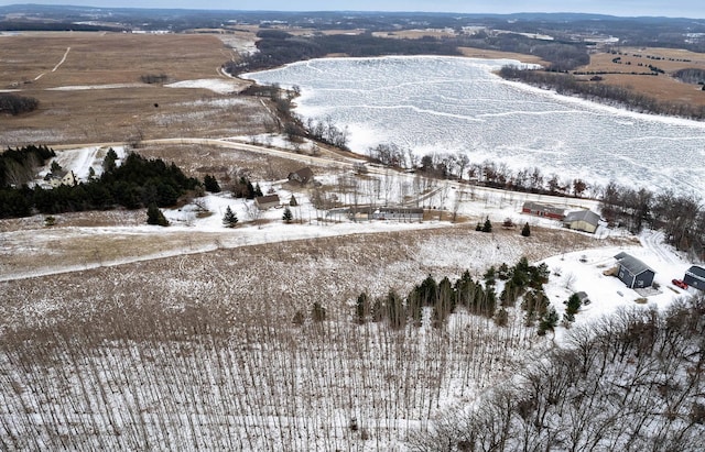 snowy aerial view featuring a rural view