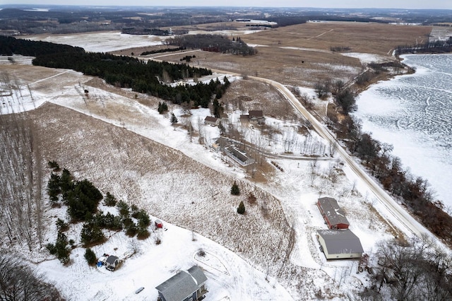 snowy aerial view featuring a rural view