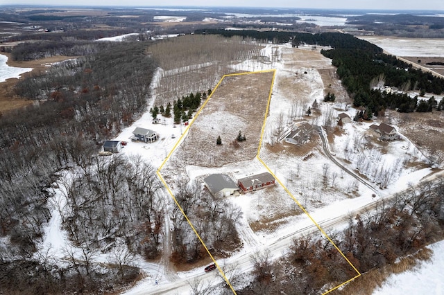 snowy aerial view featuring a rural view