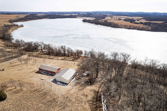 birds eye view of property with a rural view and a water view