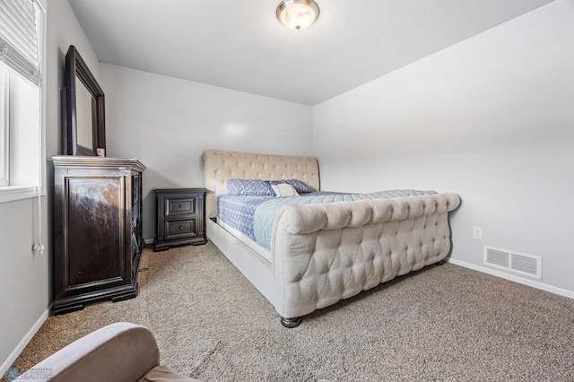 bedroom featuring light carpet