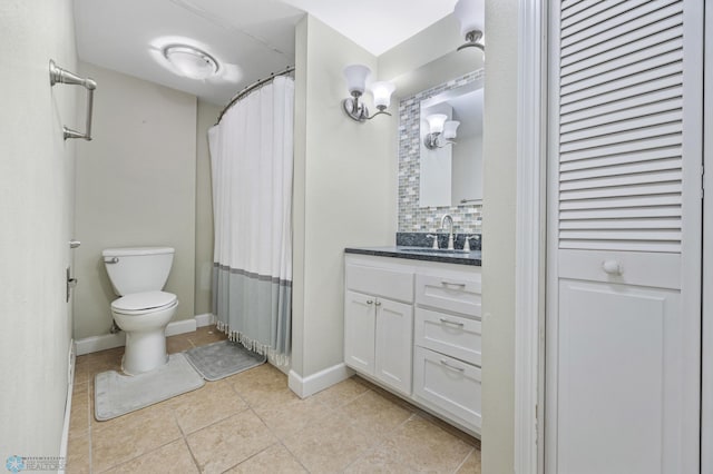 bathroom featuring decorative backsplash, vanity, a shower with shower curtain, and toilet