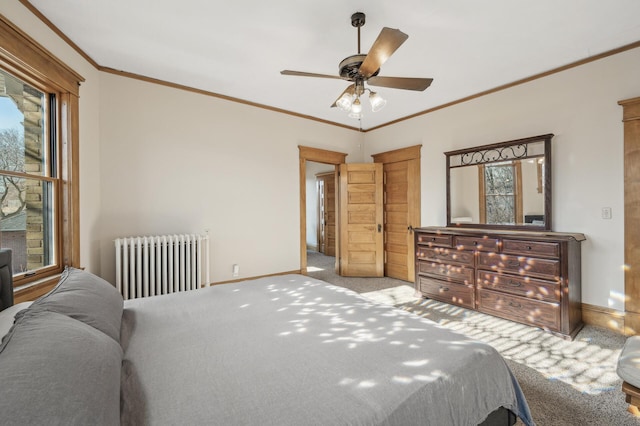 carpeted bedroom featuring ornamental molding, radiator heating unit, and ceiling fan