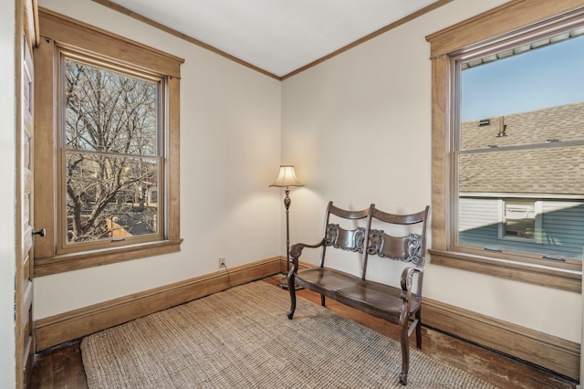 sitting room featuring hardwood / wood-style flooring and ornamental molding