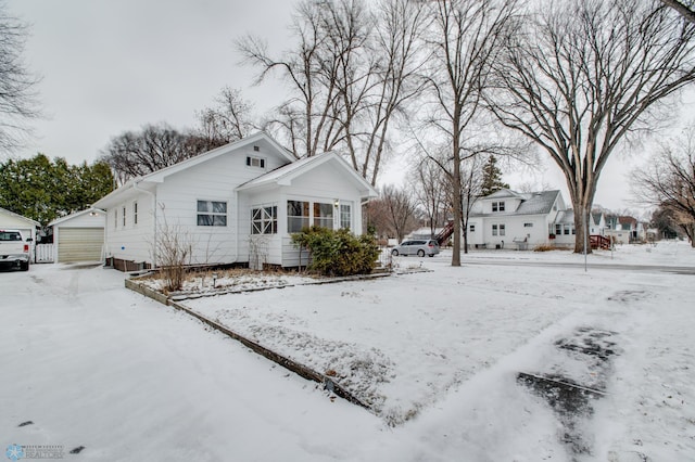 view of front of house with an outdoor structure and a garage