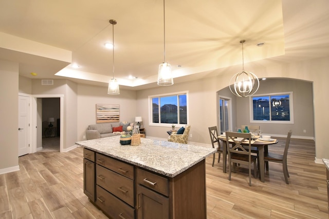 106 Fairway St, Zumbrota, MN 55992 - kitchen featuring a tray ceiling, light wood-style floors, baseboards, a chandelier, and recessed lighting