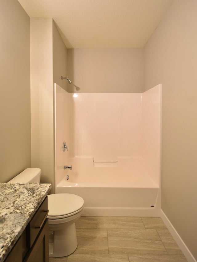 106 Fairway St, Zumbrota, MN 55992 - full bath with vanity, toilet, shower / washtub combination, wood finished floors, and baseboards