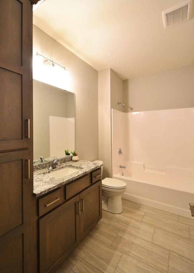 106 Fairway St, Zumbrota, MN 55992 - full bath featuring vanity, toilet, and tub / shower combination