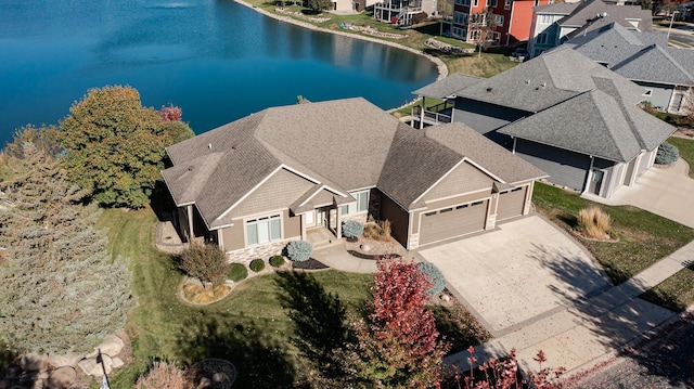 birds eye view of property with a water view