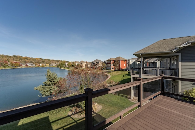 wooden deck featuring a water view