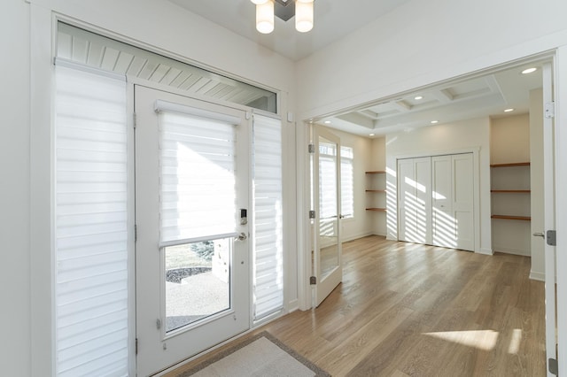 doorway to outside with light wood-type flooring